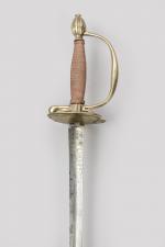 Epée d’officier modèle 1767 

Pommeau en olive rainuré. Garde à...