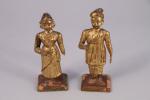 Inde, Bengale, début XXe siècle.
Couple indien

deux statuettes en bois doré.

Haut....