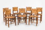 Charlotte Perriand (Française, 1903-1999)Sept chaises, c. 1947en bois massif et...