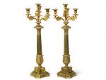Importante paire de flambeaux en bronze doré à quatre lumières....