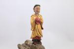 Chine - Vers 1900
Groupe sur un rocher

en bois sculpté et...