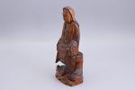 Chine - XIXe siècle
Trois statuettes de Guanyin 

en bois, l'une...
