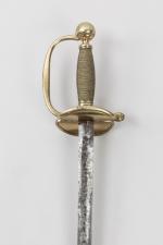 Epée d’officier subalterne, modèle 1816 

Fusée filigranée de laiton. Pommeau...