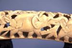 DEUX DEFENSES d'éléphant d'Asie, en ivoire sculpté, représentant 11 et...