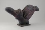 Roger CHOMEAUX, dit CHOMO (1907-1999)OiseauSculpture en siporex à patine rougeHaut....