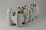 Roger CHOMEAUX, dit CHOMO (1907-1999)PleureusesSculpture en siporex blanc à décor...