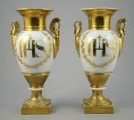LIMOGES. Paire de vases d'église de forme "fuseau". Porcelaine blanche...