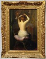 Étienne TOURNES (1857-1931).Femme à la toilette.Toile signée en haut à...