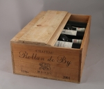 MÉDOC. Château Rollan de By, 2001. 11 bouteilles. Caisse bois.