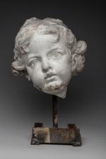 TÊTE DE PUTTO en marbre.XVIIe--XVIIIe, inspirée de l'Antique.Haut. 26 cm....