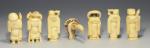 SUITE de 6 OKIMONOS figurant des personnages en ivoire sculpté....