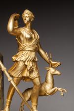 PENDULE. Diane chasseresse.Bronze doré à deux patines. La Déesse symbolisée...