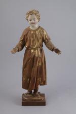 CHRIST ENFANT. Statuette en bois sculpté polychrome et traces de...