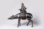 JAPON - début du XXeLao-Tseu sur son âne.Bronze à patine...