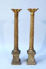 Paire de SELLETTES de forme colonneen bois doré, les colonnes...