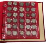 Un CLASSEUR Numis rouge contenant 123 monnaies (96 en argent...